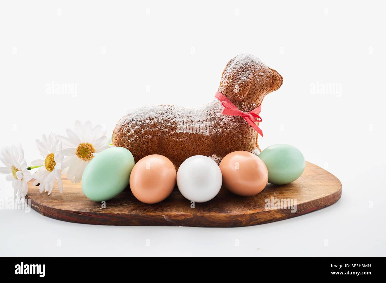 Easter lamb cake with eggs and daisies celebrating spring Stock Photo