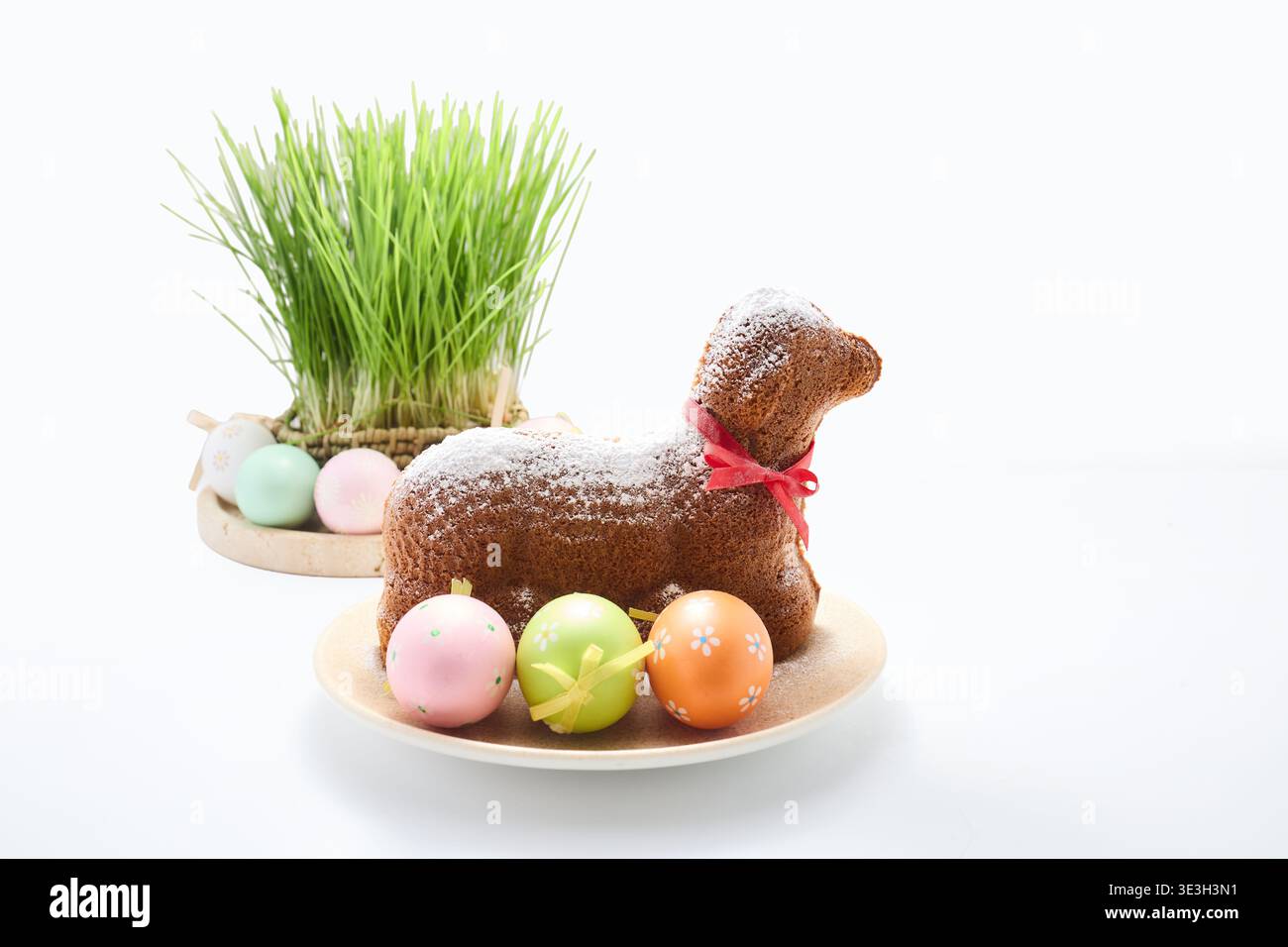 Easter lamb cake with decorative eggs and green grass Stock Photo