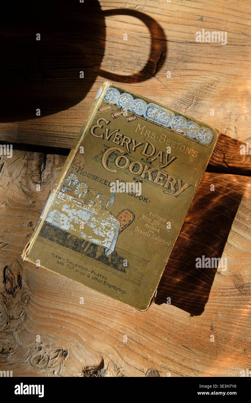 mrs beeton's every day cookery book on wooden kitchen table top Stock Photo