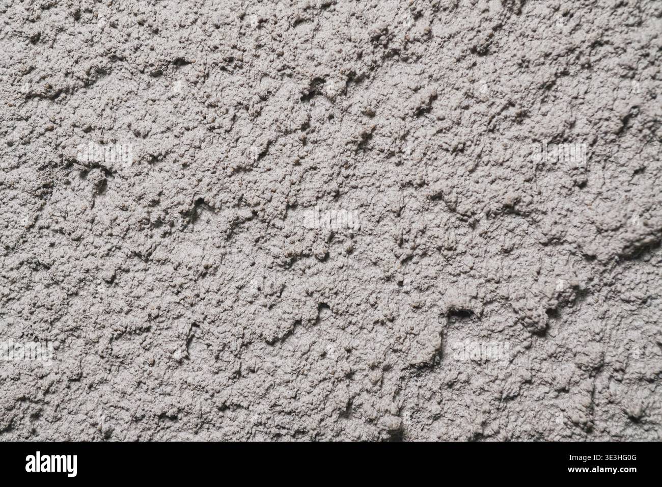 Textured Surface with Intricate Patterns and Subtle Color Variations in a Plaster Finish Stock Photo