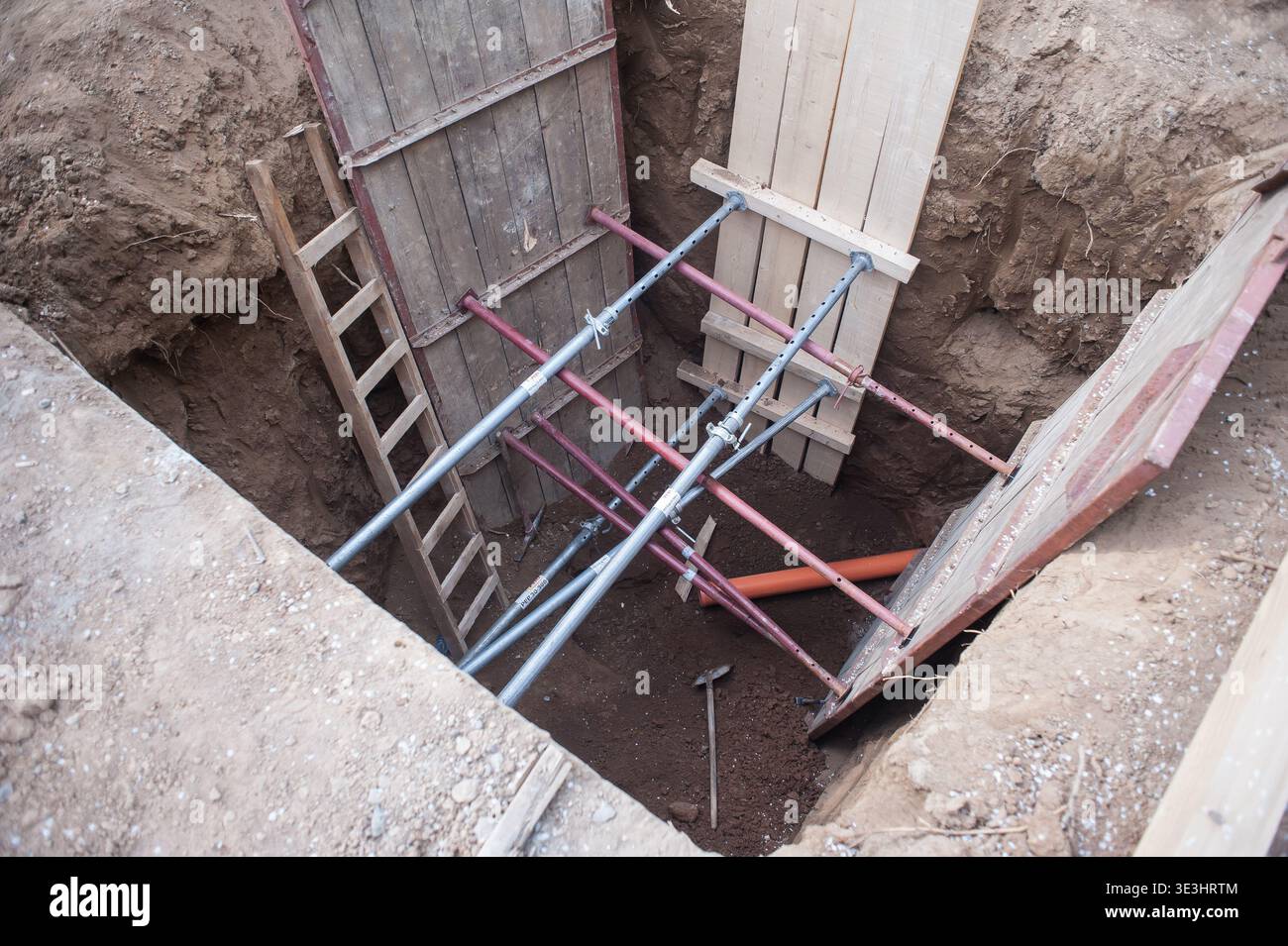Workers prepare for a major construction project, digging deep into the ...