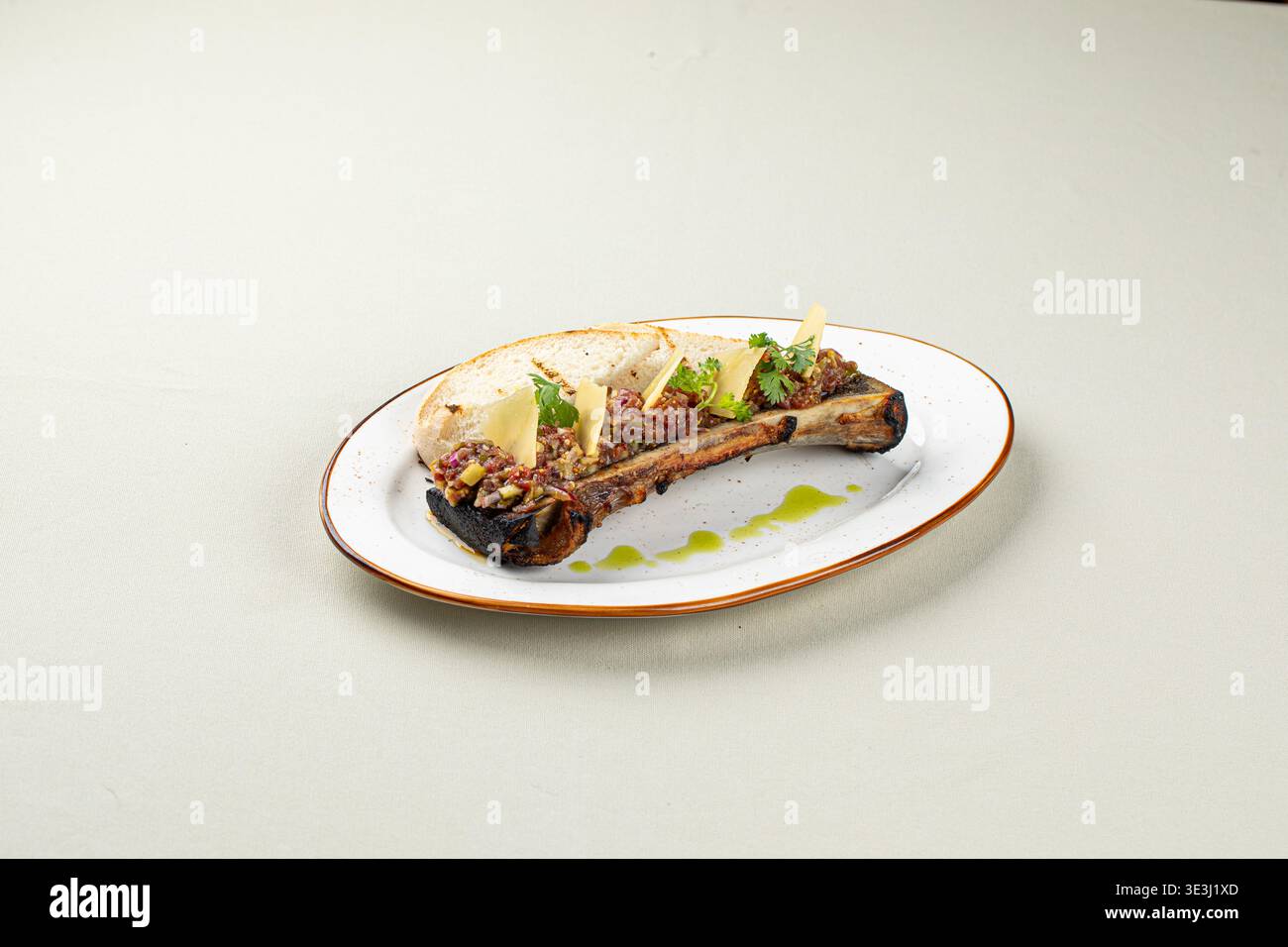 Bone marrow with beef tartare and bread slices Stock Photo
