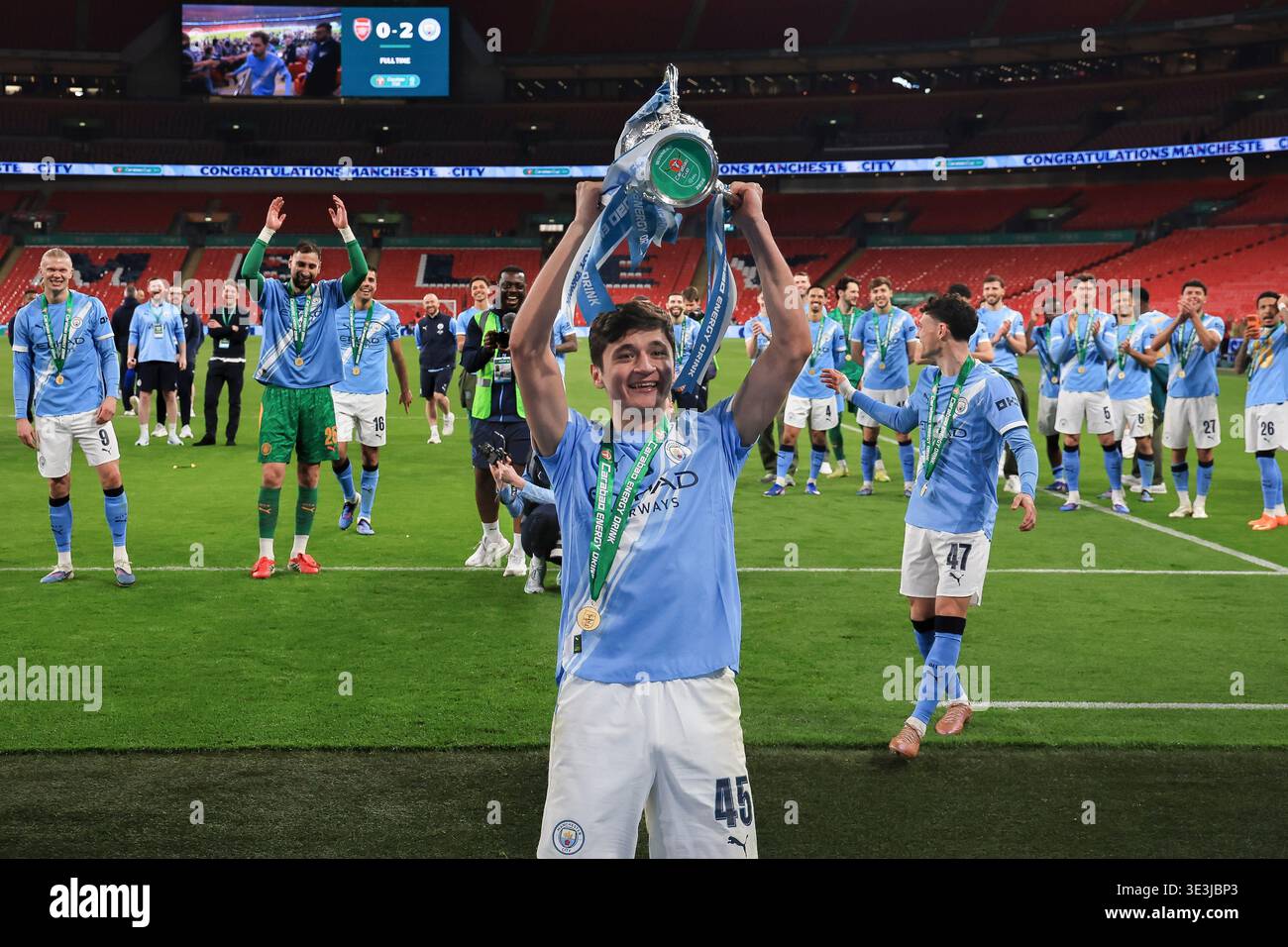 abdukodir-khusanov-of-manchester-city-lifts-the-trophy-after-the