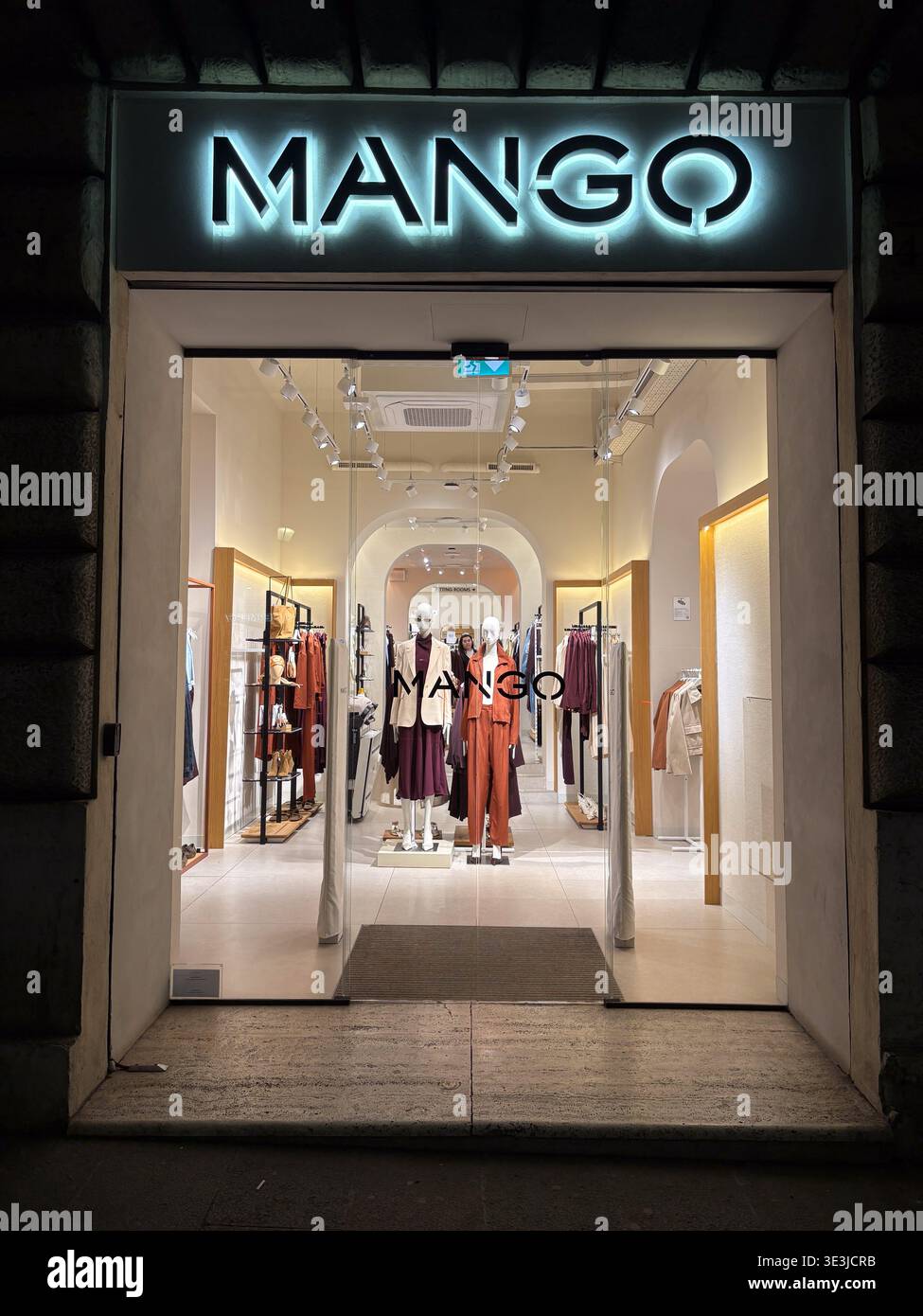 Mango Building MANGO retail shop. Rome, Italy. Illuminated sign on historic stone ...