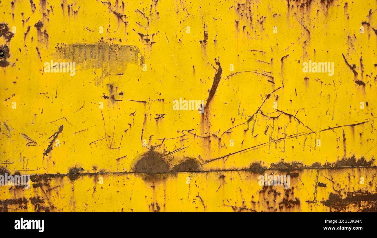 Yellow rusty metal plate with scratches and corrosion grunge texture background - Smartphone Captured Stock Image