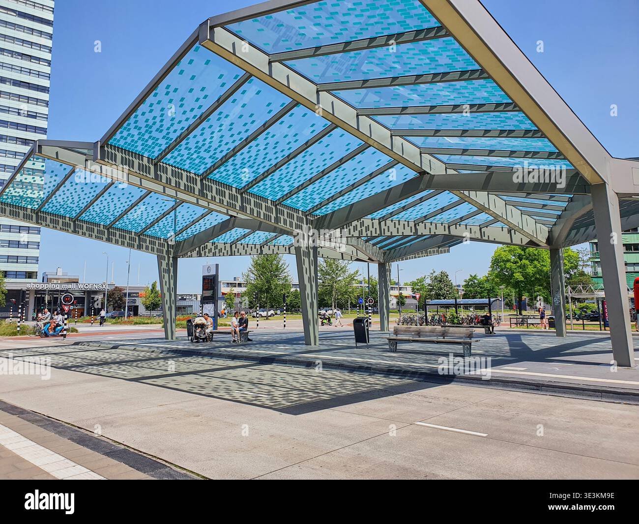 Framework Translucent A modern architectural canopy structure in an urban plaza featuring a ...