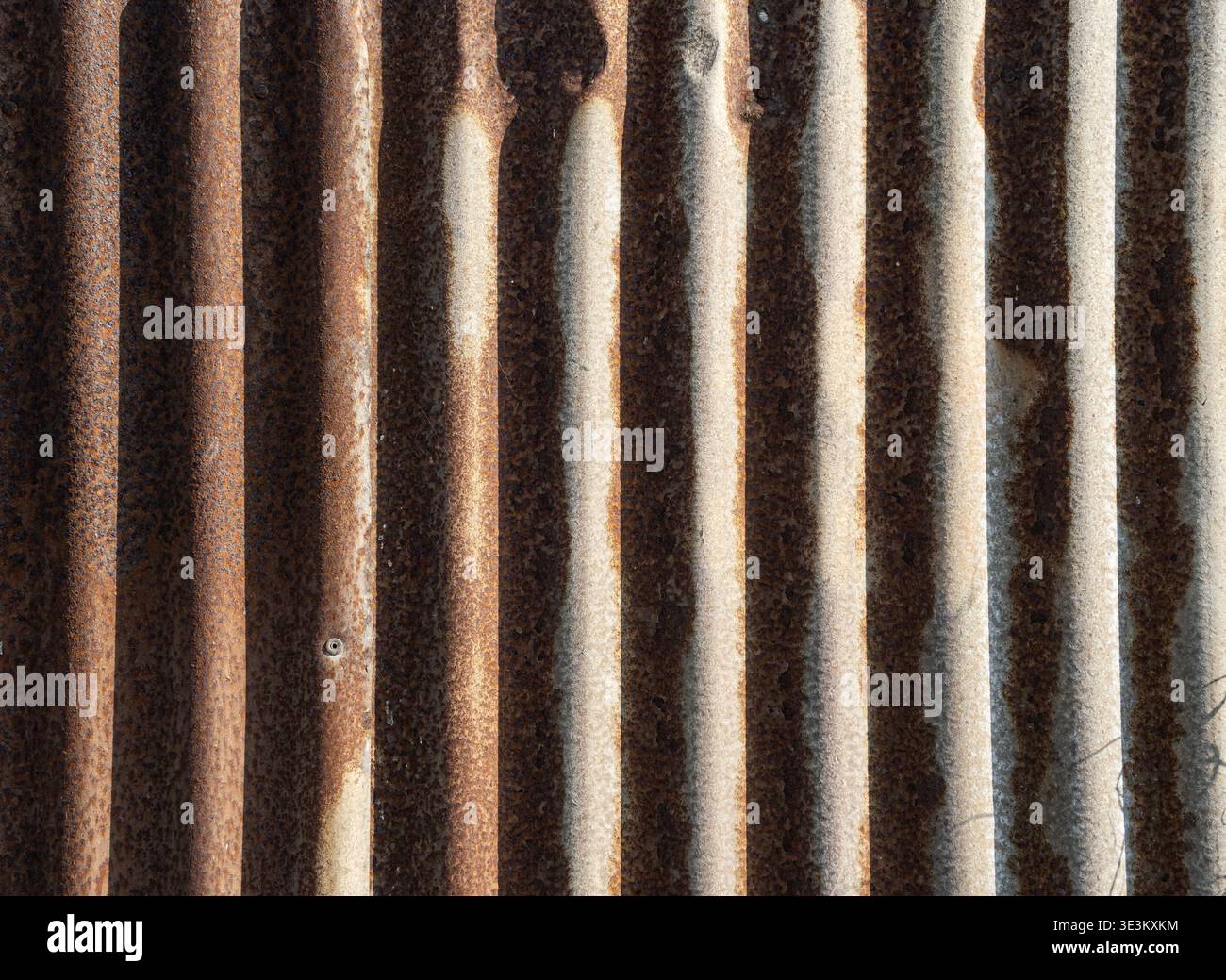 Industrial background featuring rust and corrugated structure. Stock Photo
