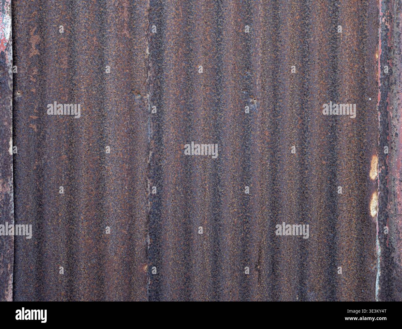 Industrial background featuring rust and corrugated structure. Stock Photo