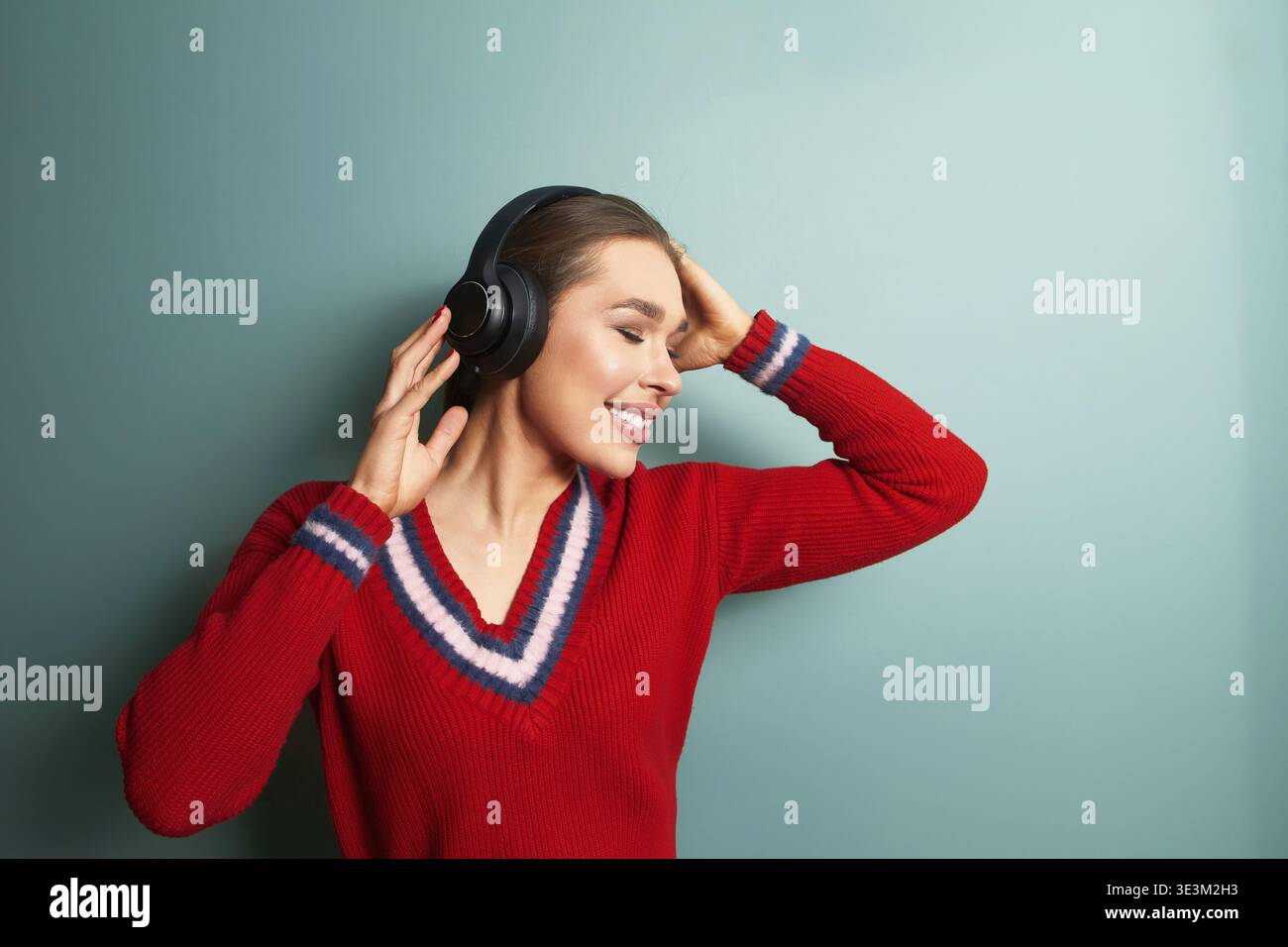 Woman in red sweater on hi-res stock photography and images - Alamy