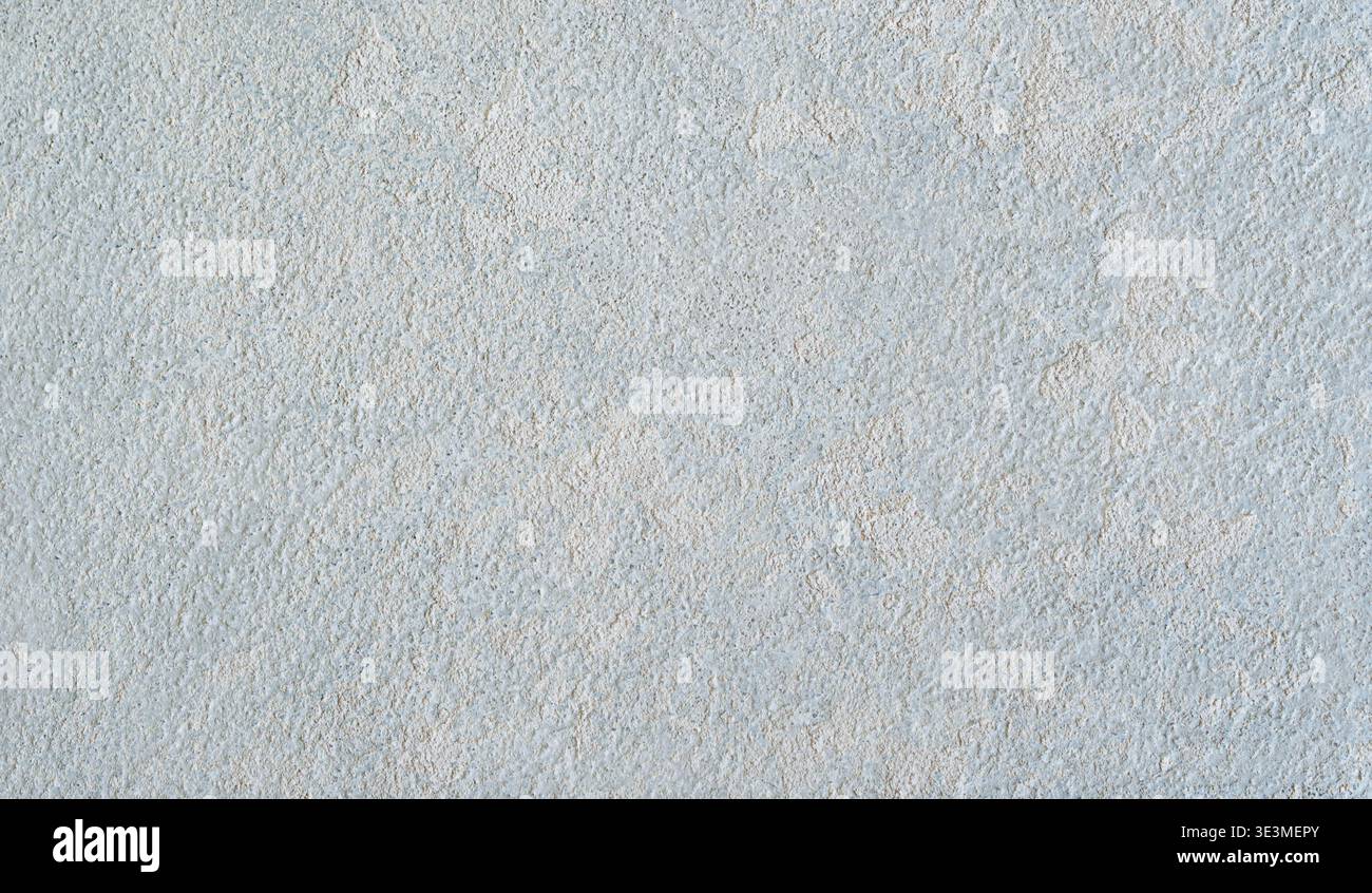 Textured light gray wall surface with subtle variations in tone and pattern, suitable for backgrounds in design projects or interior applications Stock Photo