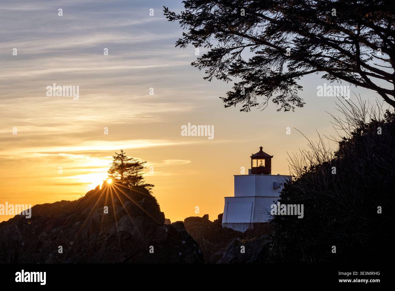 Sunset at Amphitrite Point Lighthouse - Ucluelet, Vancouver Island, British Columbia, Canada Stock Photo