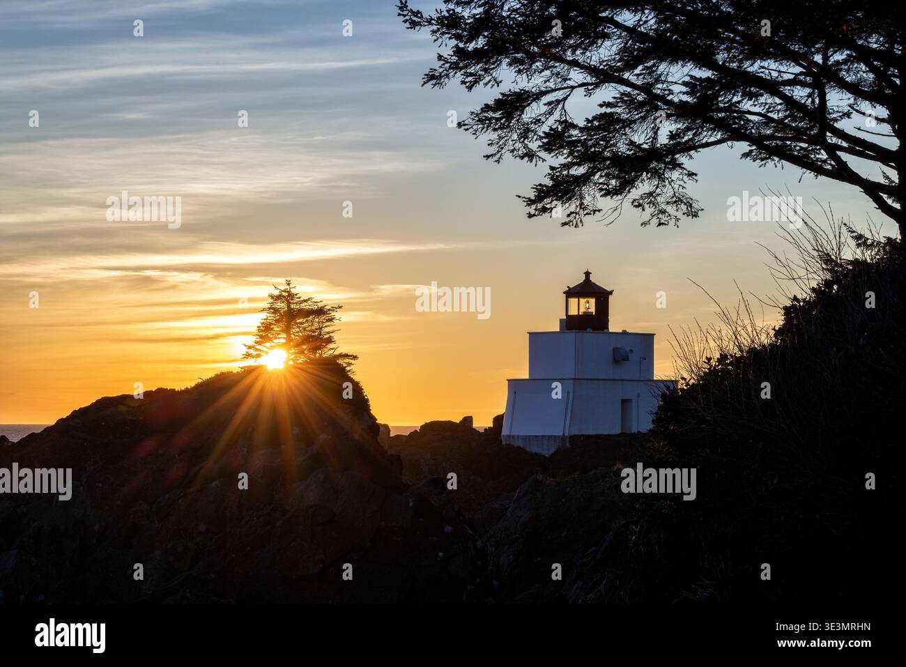 Sunset at Amphitrite Point Lighthouse - Ucluelet, Vancouver Island, British Columbia, Canada Stock Photo