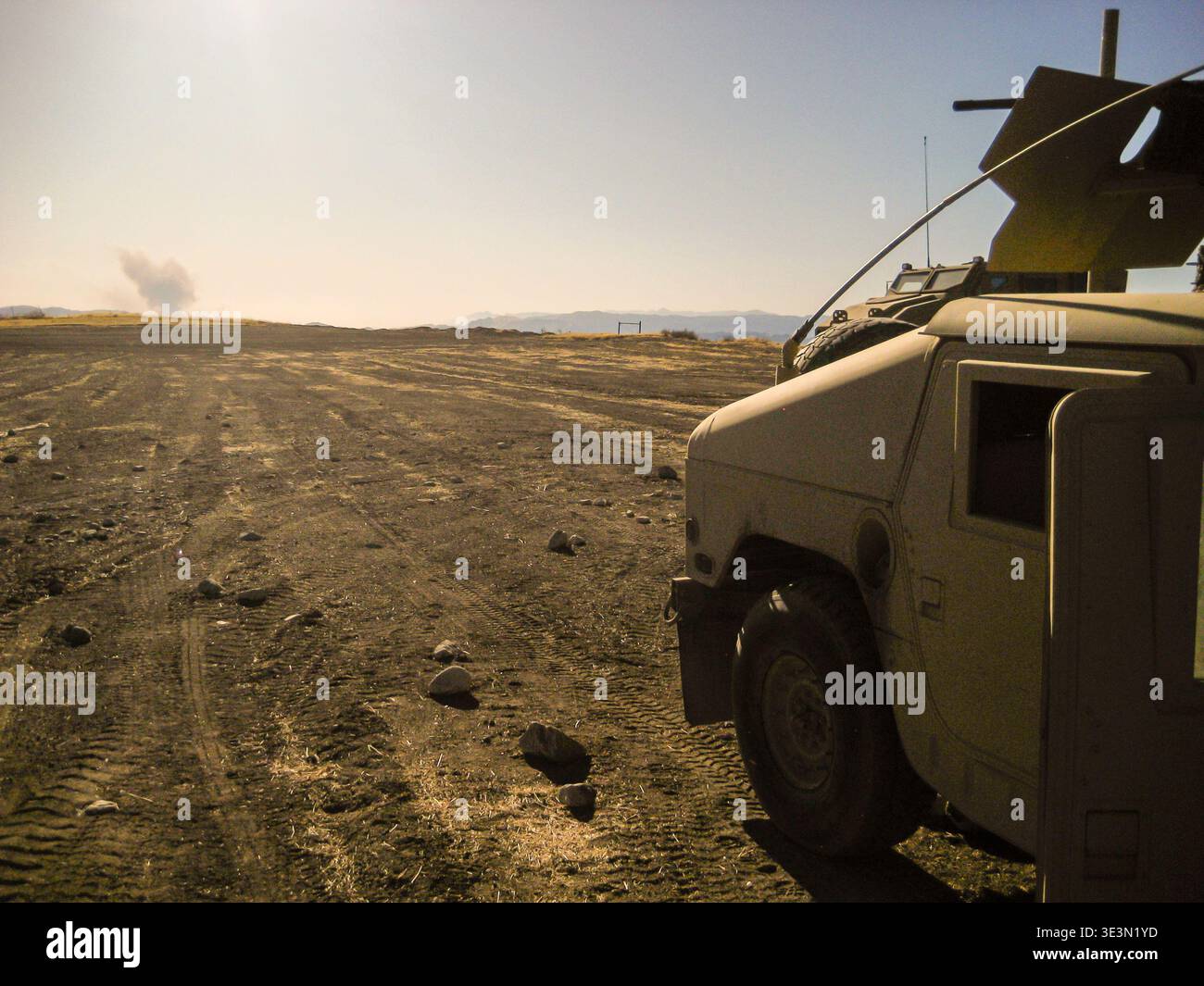 Desert-camouflage Humvee equipped with a mounted communication system ...