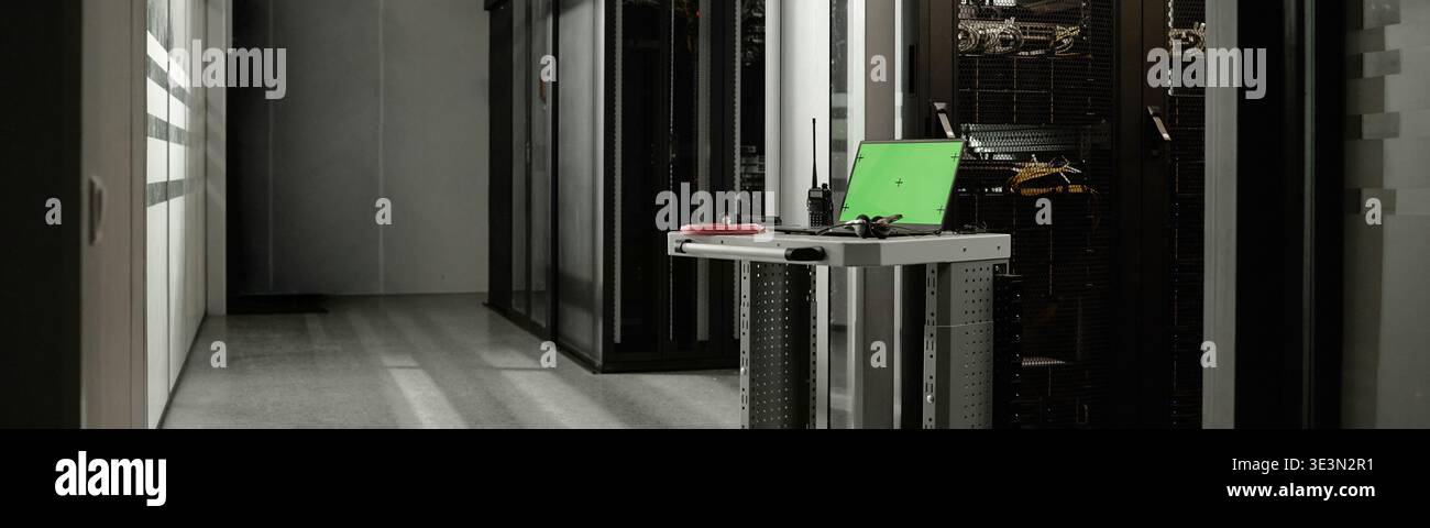 Rolling Workstation Featuring Laptop and Tools Positioned in Server Room Stock Photo