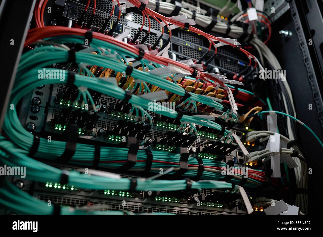 Network Server Rack Displaying Data Cables Transmitting Information Stock Photo