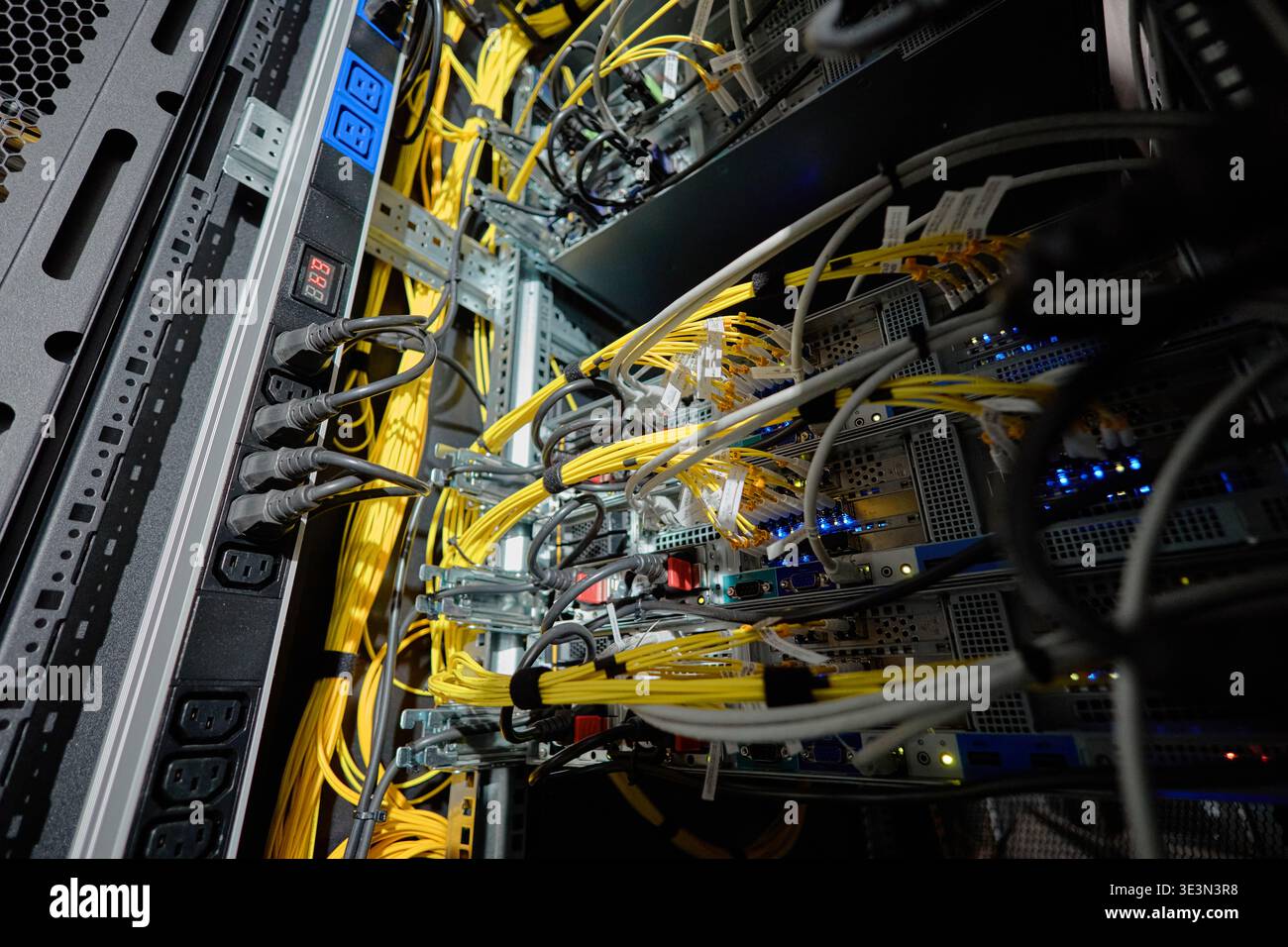 Network Servers Processing Data with Multiple Ethernet Cables in Data Center Stock Photo