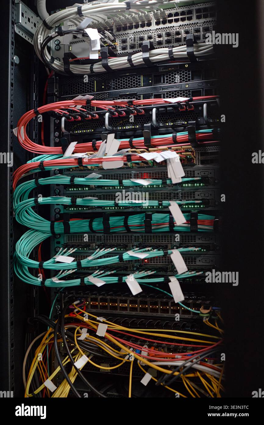 Network Server Rack Displaying Organized Ethernet Cables and Data Connections Stock Photo