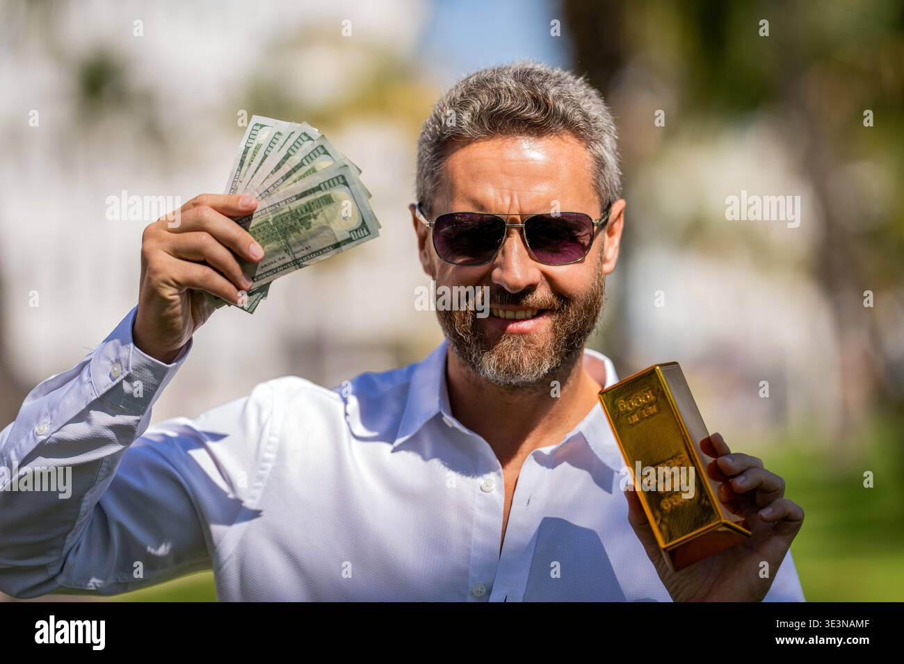 Rich businessman hold gold and cash money. Financial success ...