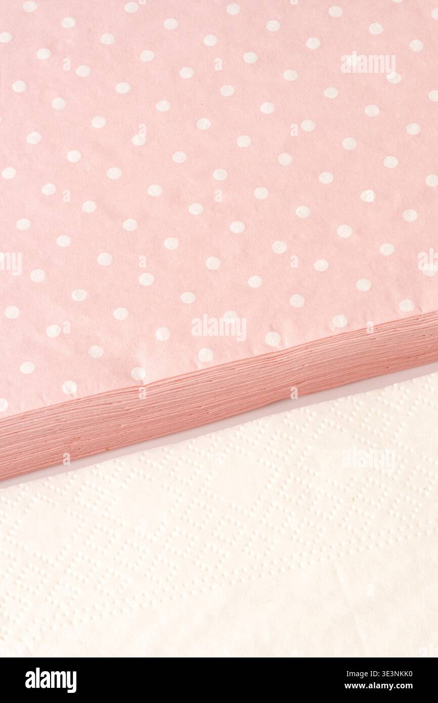 Polka dot fabric on a table with a white surface underneath during daylight Stock Photo