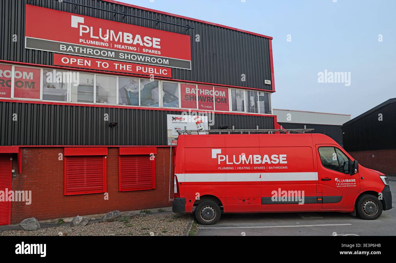 Plumbase builders merchant branch and red delivery van in Warrington, Cheshire Stock Photo