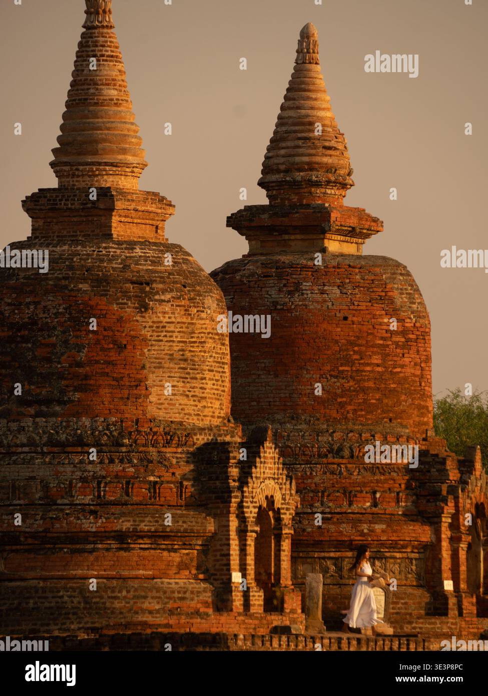 View of ancient red brick and stone temples bathed in the warm glow of sunset, standing as silent sentinels of history, Old Bagan, Mandalay Region, My Stock Photo