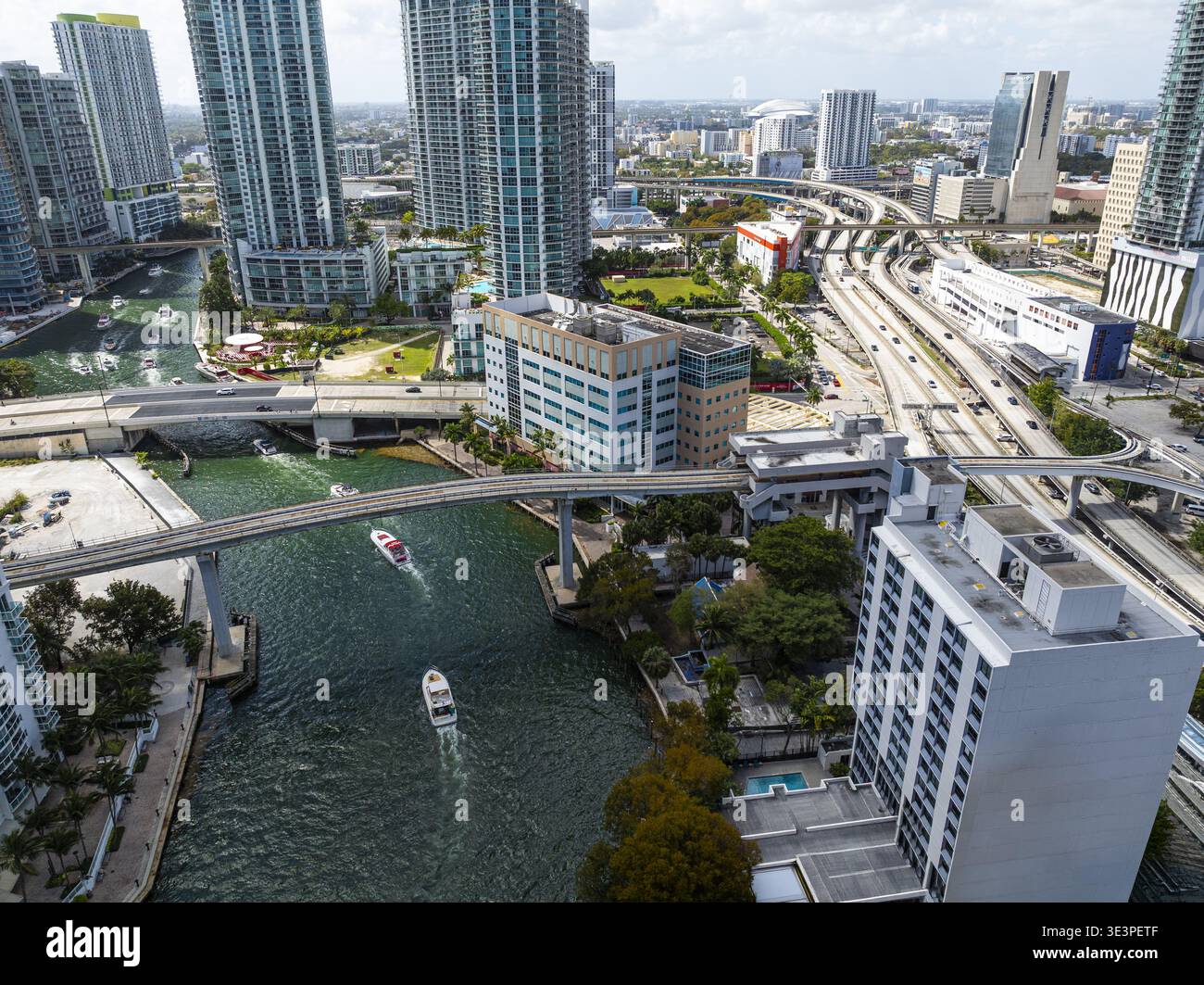 Aerial view of the vibrant Brickell Key bridge over the sparkling Miami ...