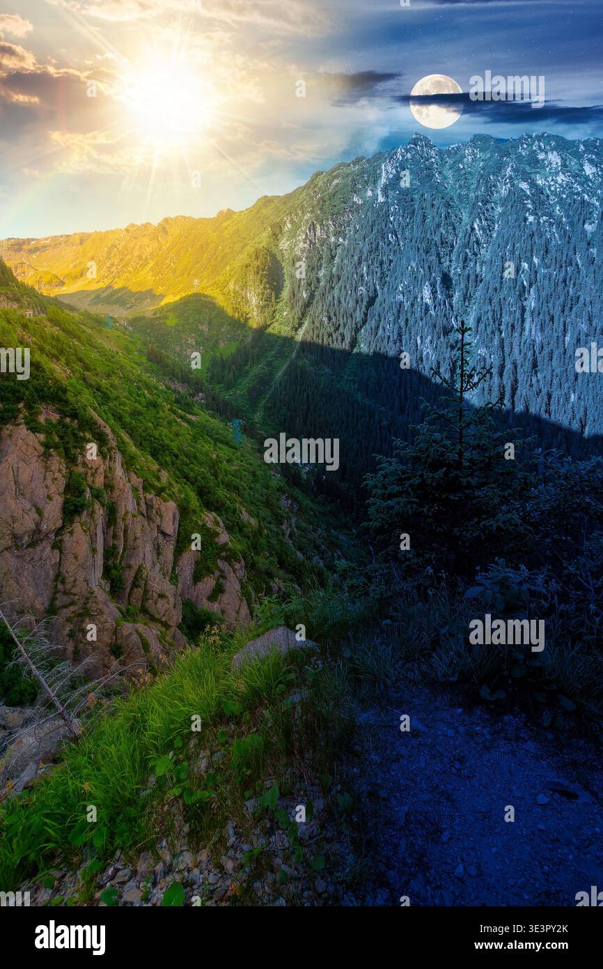 Day meet night. Valley on summer solstice in mountains. Sun and moon over gorgeous mountainous landscape at twilight. Rocky cliffs and forested slopes Stock Photo