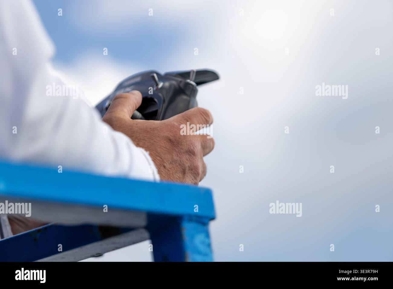 Older Person Using Remote Interface Controller Stock Photo