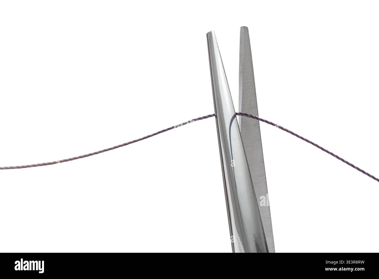 sewing scissors cutting thread on white isolated background Stock Photo