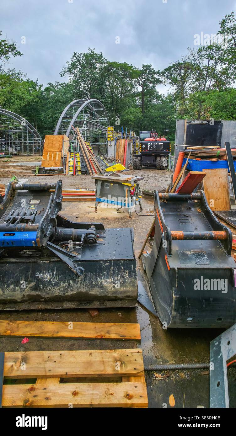 Berlin, Germany - July 21, 2025: . Construction area features heavy machinery and various materials in organized layout - Smartphone Captured Stock Image