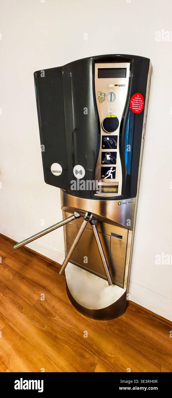 Berlin, Germany - July 24, 2025: . Modern turnstile access control system features sleek design for enhanced security - Smartphone Captured Stock Image
