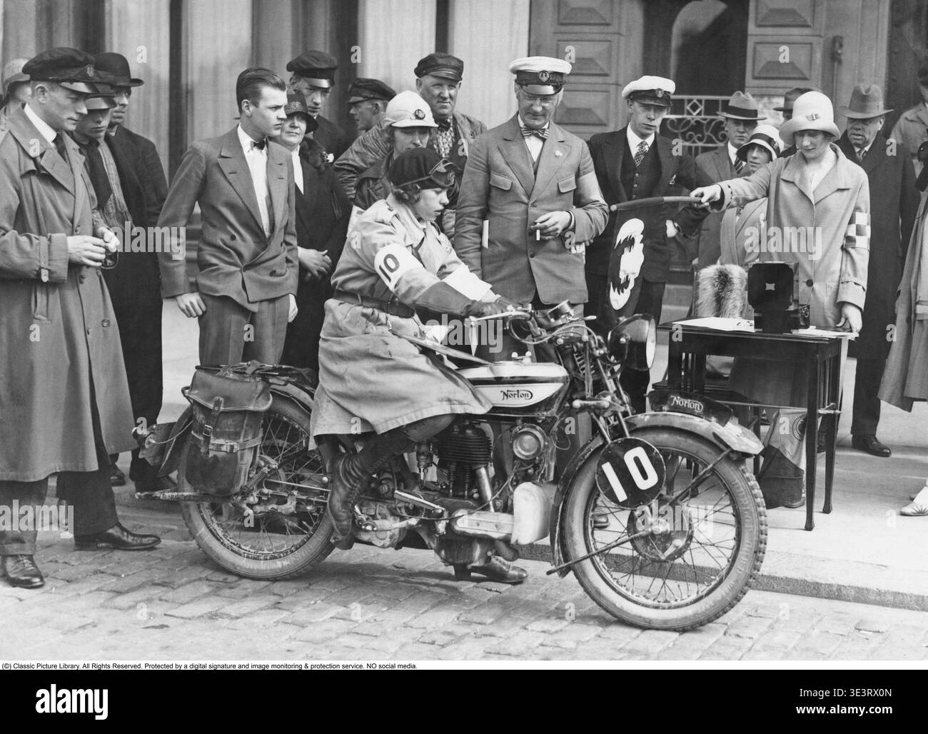 Woman on a motorcycle, June 1929. The start of a motorcycle race. A ...