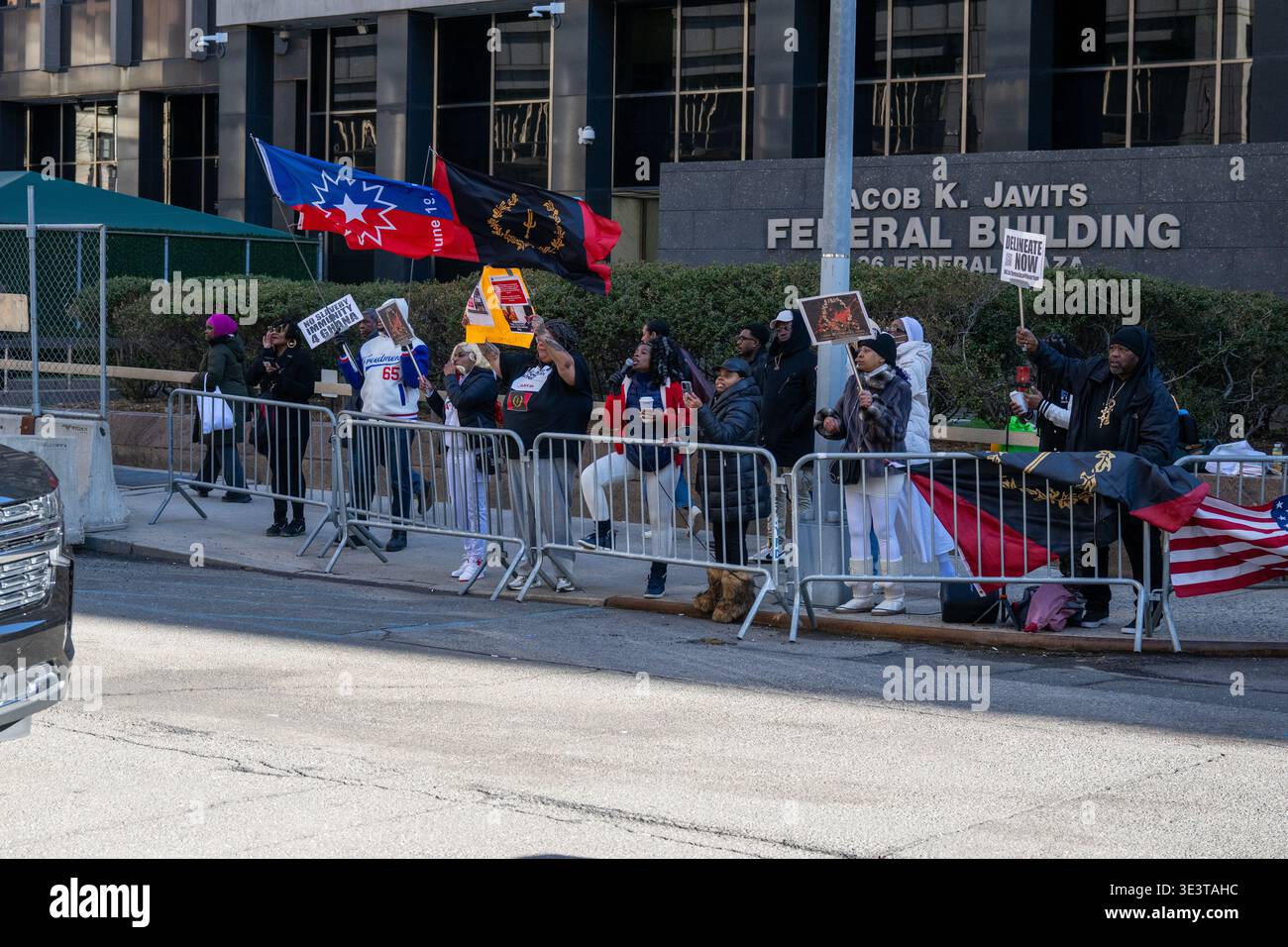 Protesters at a wreath-laying ceremony to honor victims of the Transatlantic Slave Trade at the African Burial Ground National Monument in New York on Stock Photo