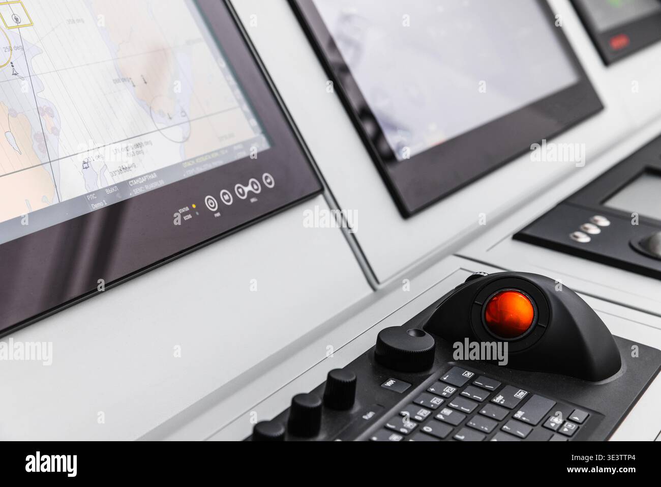 Bridge Panel Display High-tech marine navigation console on a ship bridge featuring multiple ...