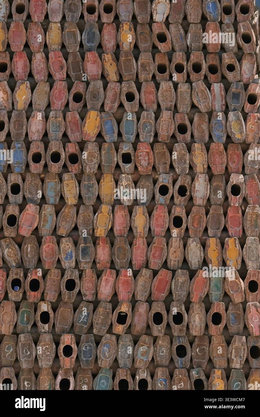 Rusty metal scaffolding components arranged in repeating pattern. Industrial texture background Stock Photo