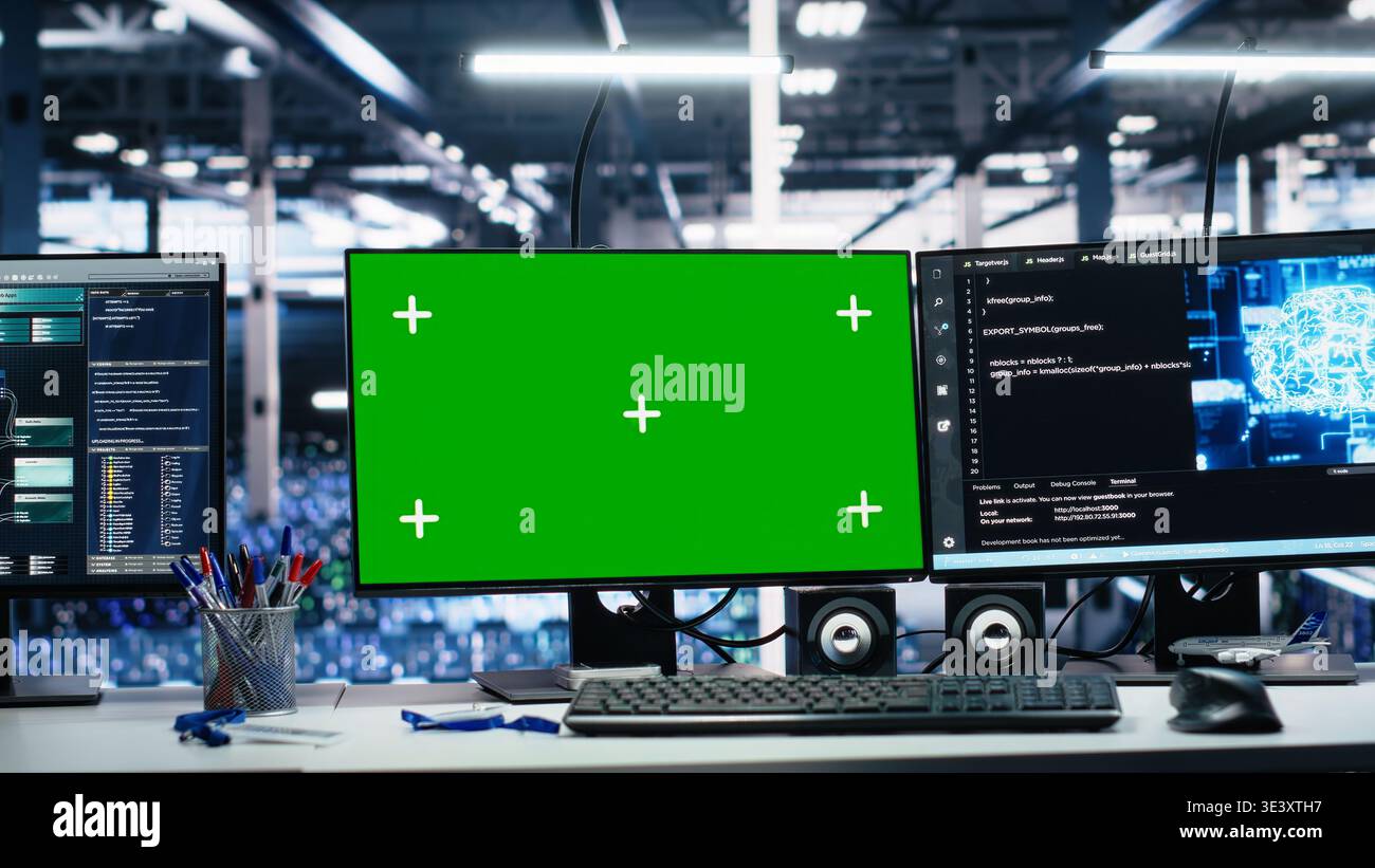 Data center green screen computers showing neural network visualization and code debugging software running. Chroma key PCs in server room powering machine learning and automated research tasks Stock Photo
