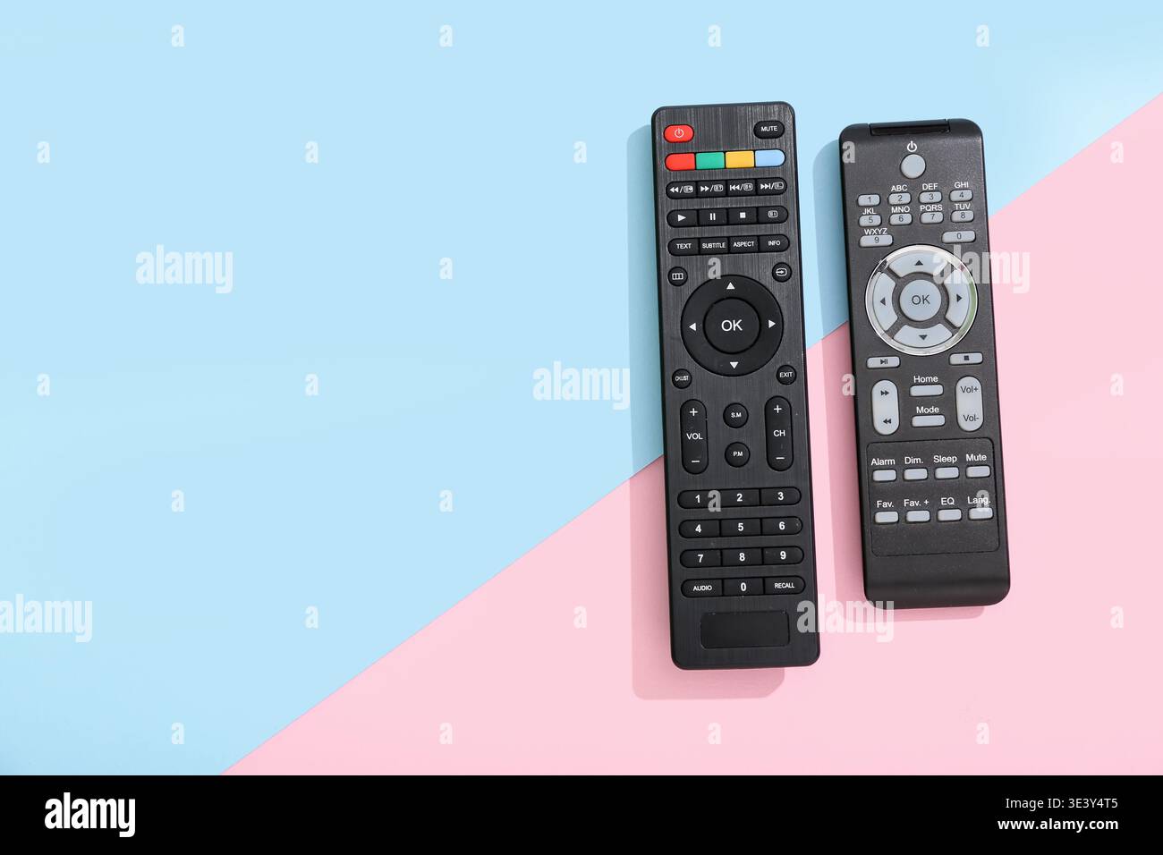 Different modern TV remote controls on color background Stock Photo