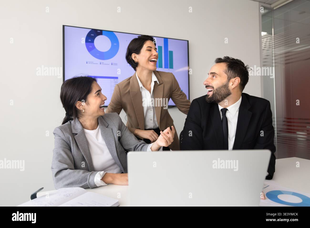 Laughing team collaborating during meeting in office Stock Photo