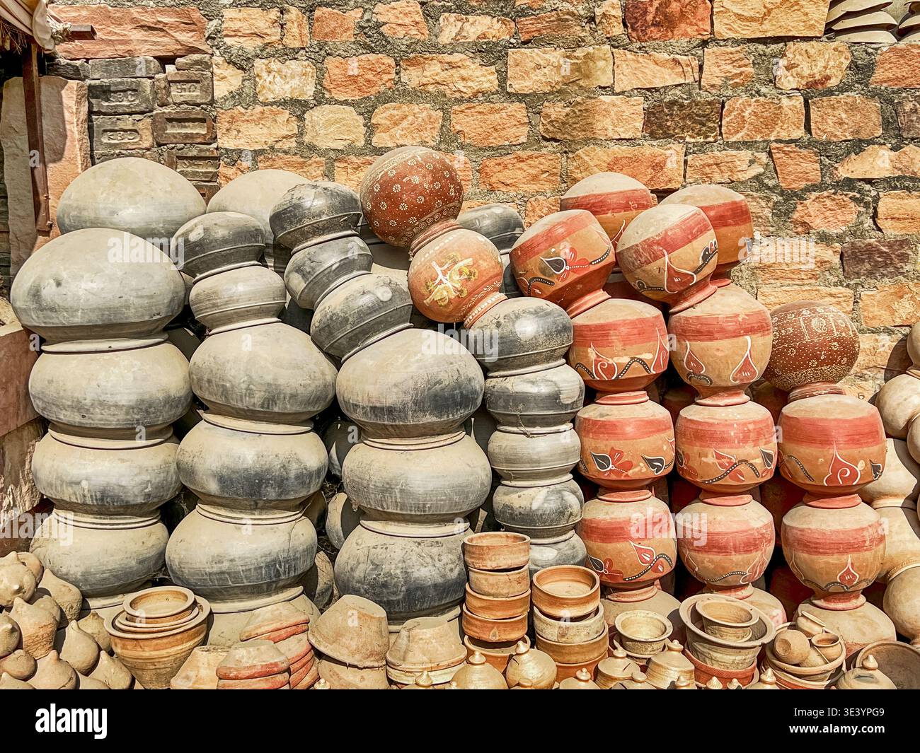 A huge pile of red and black household storage pots has been heaped up at a ceramics factory near Jodhpur in India. Stock Photo