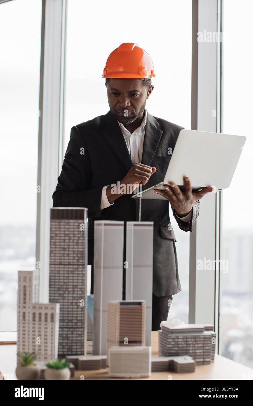 Architect Reviews Building Models Stock Photo