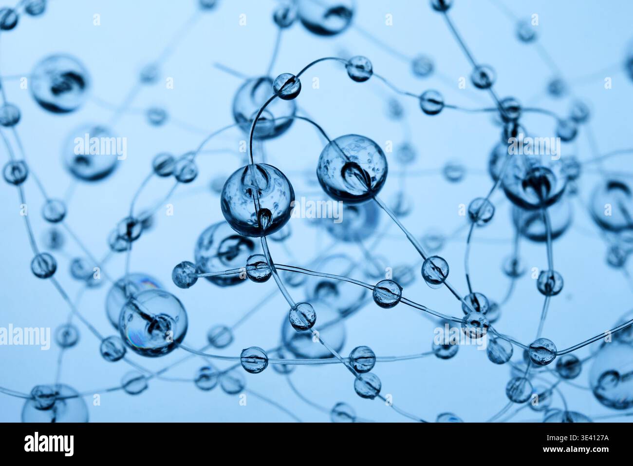 Transparent spheres forming abstract network connection blue background Stock Photo