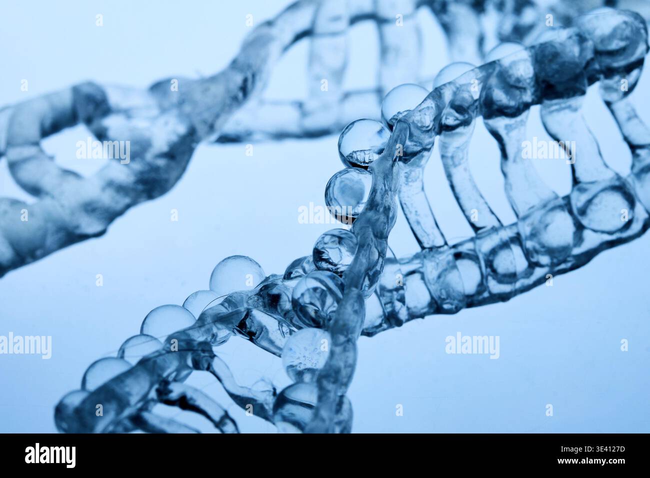 Abstract cosmetic lab. Dna double helix structure forming with clear liquid Stock Photo