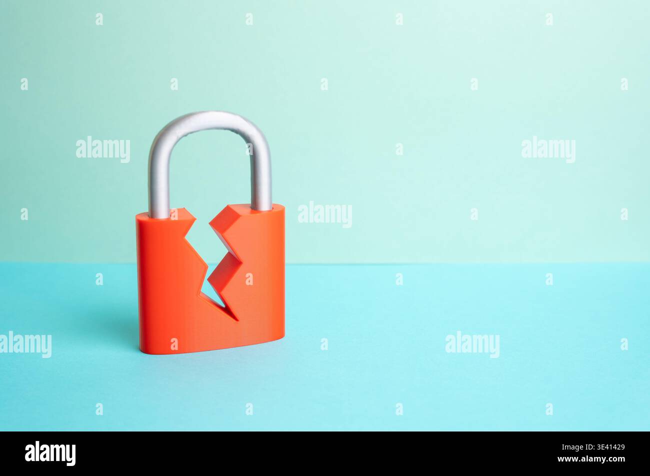 A cracked padlock. Security is compromised. The security system is compromised. Cyber risk exposes vulnerabilities. Data protection and system defense Stock Photo
