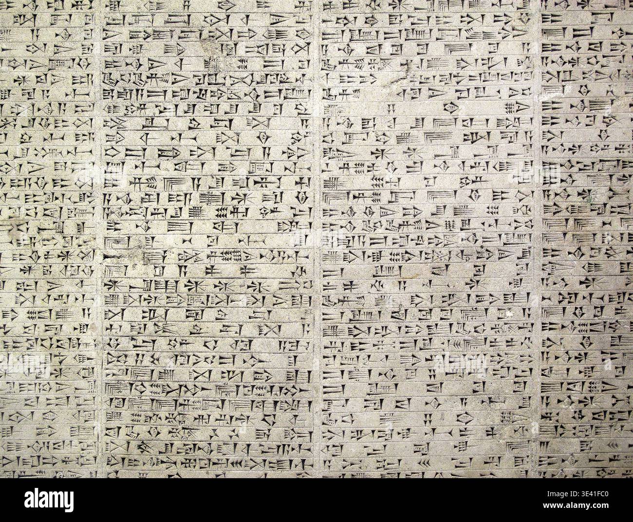 Ancient Assyrian cuneiform script carved stone; a high-detail ...