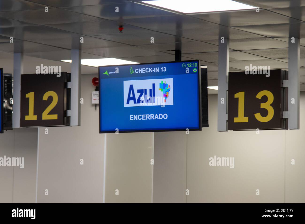 Closed airport check-in counter with an Azul Airlines electronic display. Stock Photo