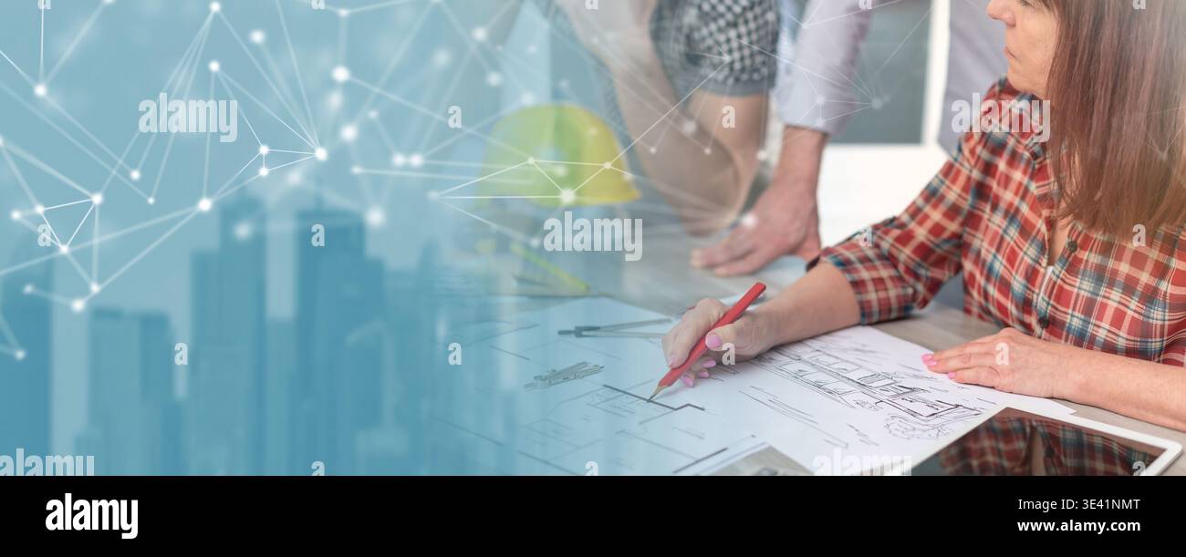 Architects working on plans at office; panoramic banner Stock Photo