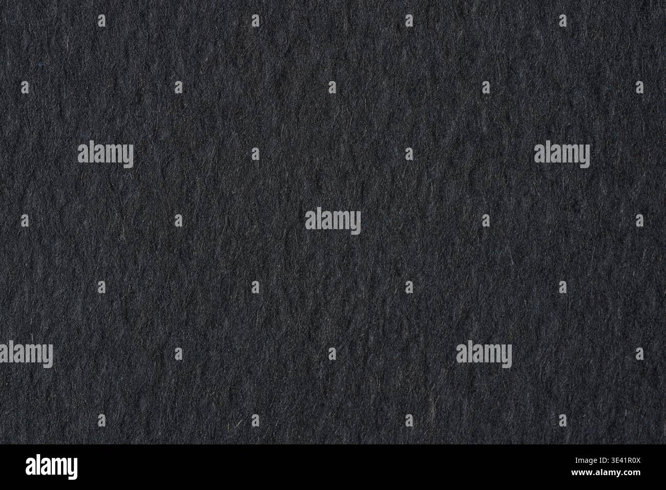Black paper texture background with rough grain and dark dramatic tone Stock Photo