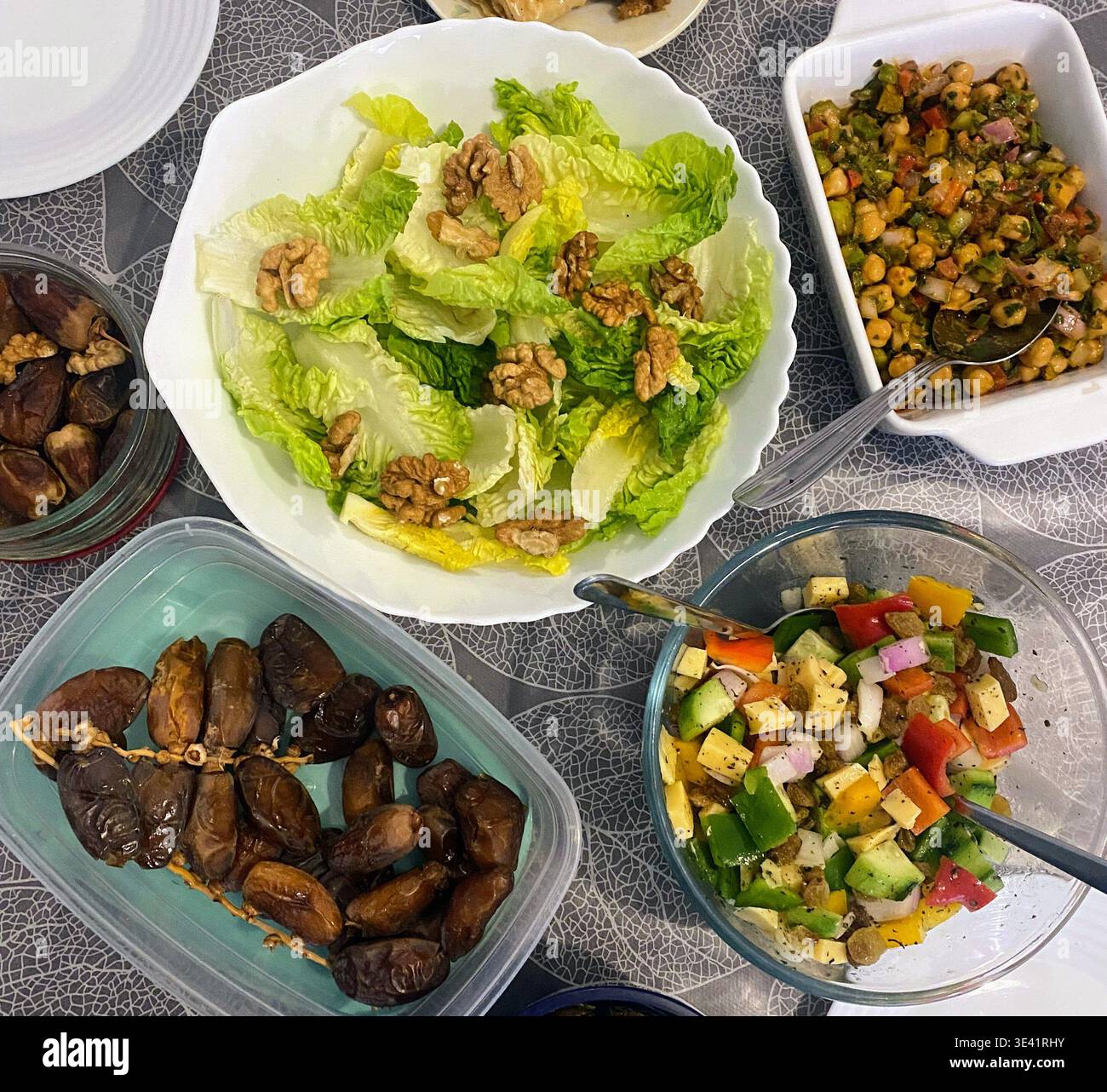 A vibrant assortment of fresh, healthy salads displayed on a table, featuring colorful vegetables, grains, and greens. Perfect for themes of wellness - Smartphone Captured Stock Image