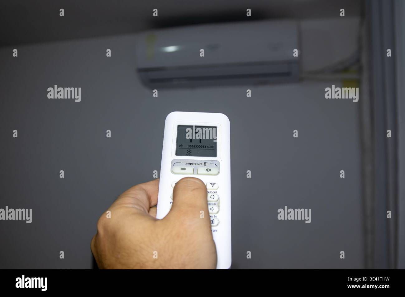 Remote control for air conditioning in a residential setting. Stock Photo