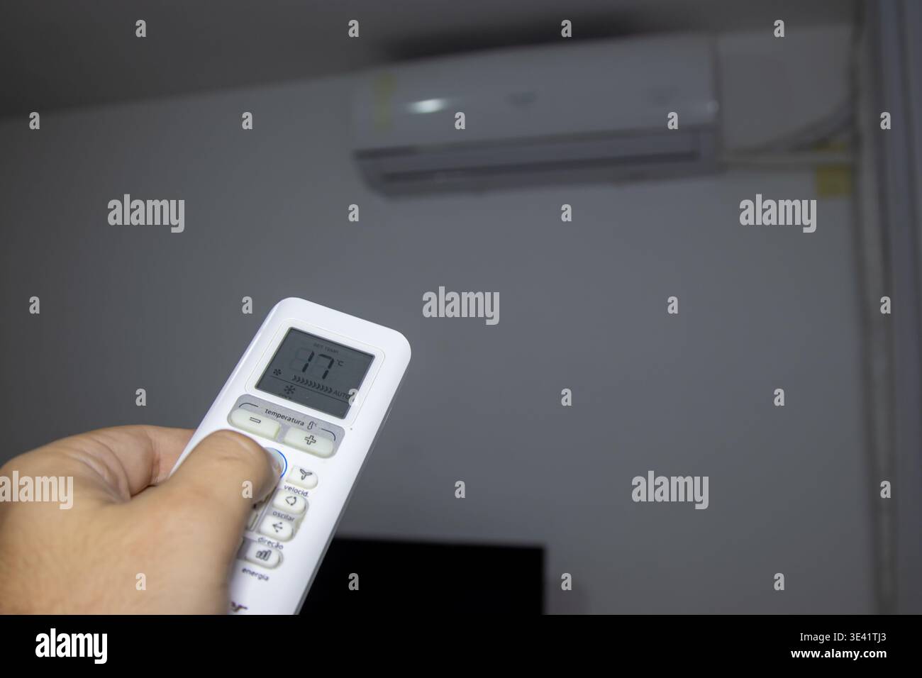 Remote control for air conditioning in a residential setting. Stock Photo